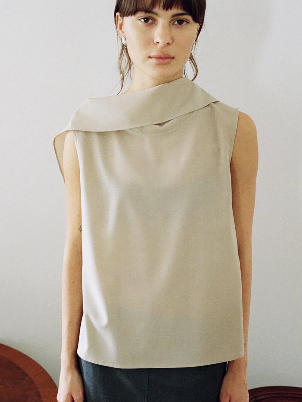 Sleeveless Draped Neck Top In Light Beige